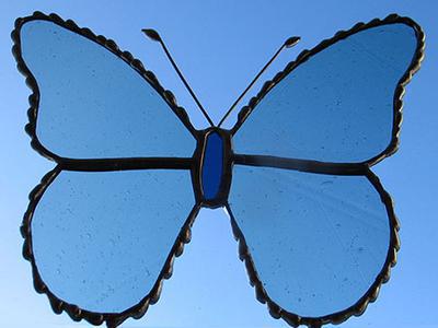 blue glass butterfly with decorative soldered edge
