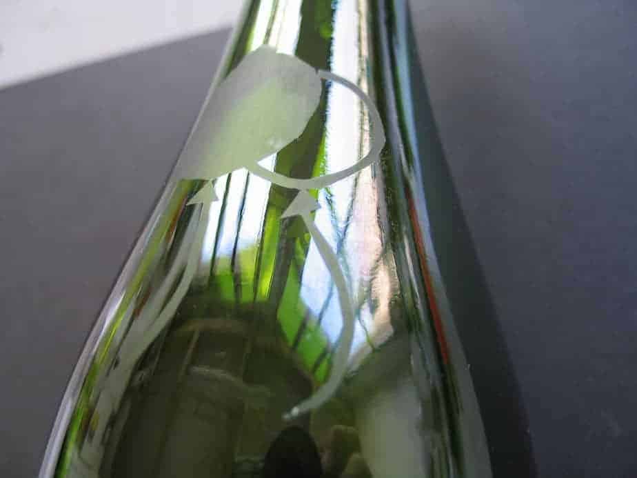 green bottle with etched balloons