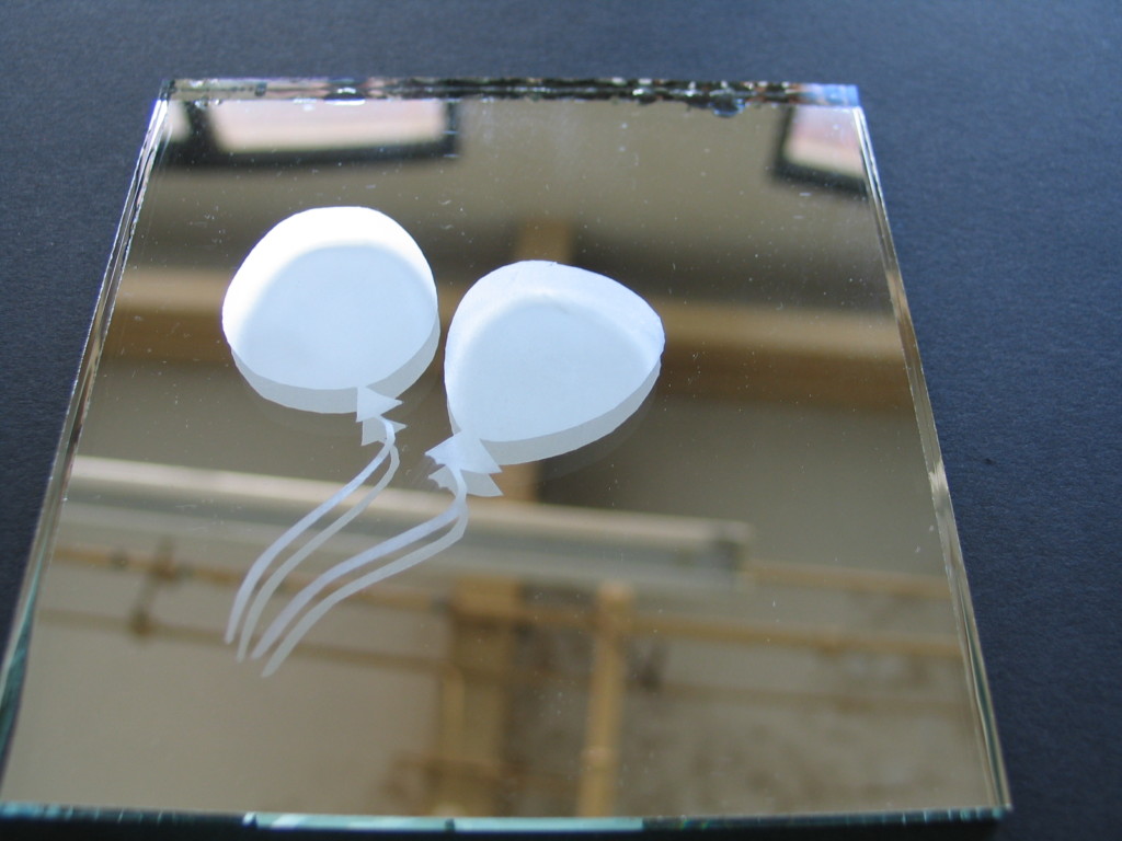 two balloons etched on mirror