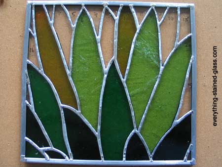 stained glass panel soldered to zinc frame