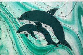 cut dolphin stained glass pieces