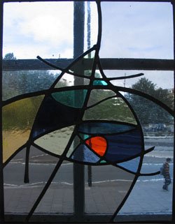 muted grey and blue stained glass panel