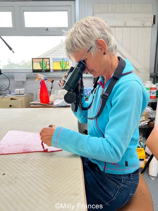 a fun photo showing that it's not good to use binoculars when making stained glass