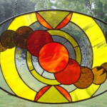 Oval stained glass panel by Lori Jones